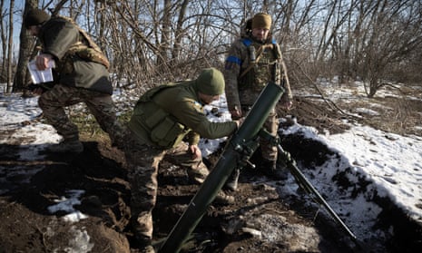 Ukrainian servicemen fire a mortar shell at the frontline position near the Vuhledar town, in Donetsk region.