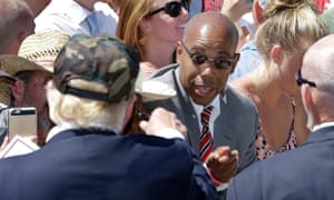 Republican presidential candidate Donald Trump, left, talks to Gregory Cheadle at a campaign rally in Redding.