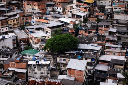 A higgledy-piggledy sprawl of two and three-storey slum houses with metal roofs