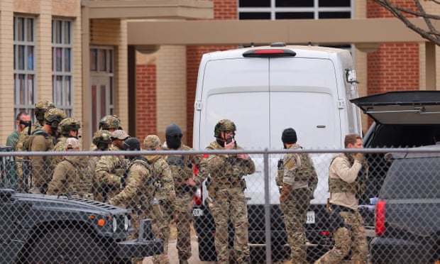 SWAT team members deploy near the Congregation Beth Israel Synagogue in Colleyville.