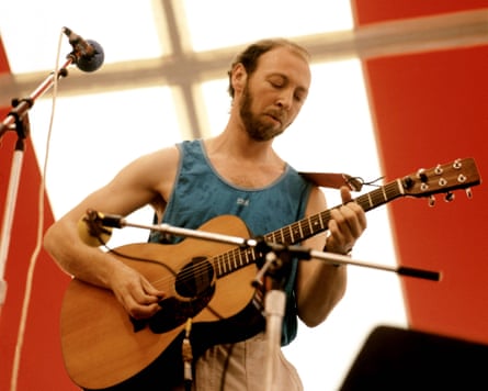 Thompson playing the guitar in 1980