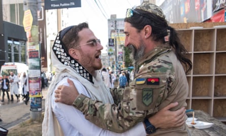 A member of Ukraine’s National Guard Brigade Azov with the call sign ‘Rabbi’ embraces an ultra-Orthodox Jewish pilgrim during a celebration of the Rosh Hashanah holiday, the Jewish New Year, amid Russia’s attack on Ukraine, in Uman, Ukraine.