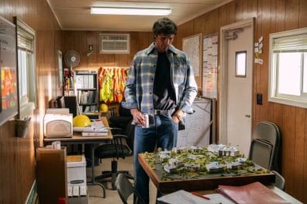 Jacob Elordi wearing a blue flannel shirt in a construction office in the TV show Euphoria