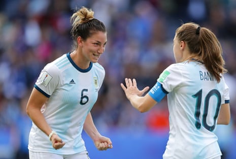 Aldana Cometti of Argentina celebrates with teammate Estefania Banini after gaining thier first ever point at a World Cup.