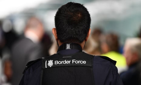 UK Border Force officer seen from behind