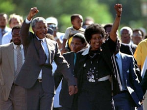 Nelson Mandela, arm aloft, jubilant on his walk to freedom.