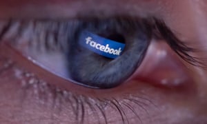 Facebook logo reflected in the pupil of an eye