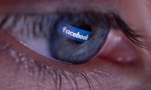 Facebook logo reflected in a person's eye