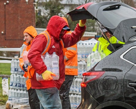 Officials distribute bottled water in Tunbridge Wells, Kent