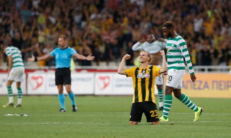 Niklas Hult celebrates at the final whistle near a dejected Moussa Dembélé after Celtic were eliminated by AEK Athens in the third qualifying round in 2018