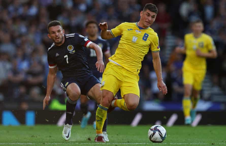 ‘A game of survival’: Ukraine prepare for final World Cup push in Wales | Ukraine 3 Ruslan Malinovskyi (right) battles with John McGinn on Wednesday.