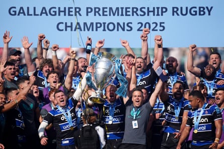 Bath’s Johann van Graan (bottom, centre right) celebrates winning the Premiership title with his players.