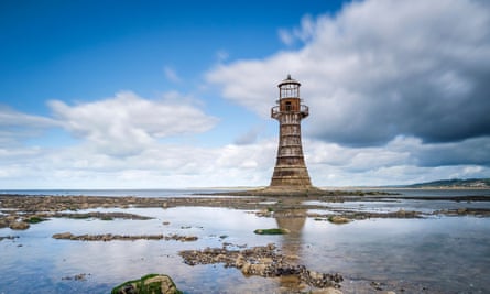 Early on in the walk there are glimpses of Whiteford lighthouse.