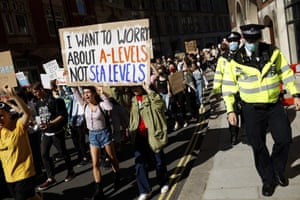 Activists march through Westminster, London, to demand politicians act on climate change promises