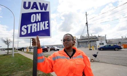 UAW member Shamiya Ware walks the picket line during a strike at a Ford plant in Wayne, Michigan, on Friday.