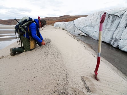 Kurt Kjær collecting sand samples at the front of Hiawatha glacier
