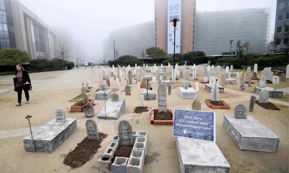 A mock cemetery set up by Save the Children in Brussels, as a reminder of the impact of six years of war on Syrian children