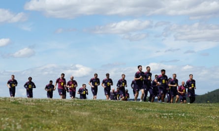 England players go on a jog under sunny skies