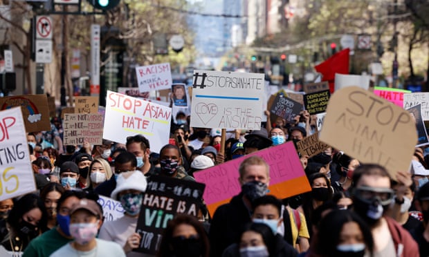 Asian Americans and Pacific Islander (AAPI), and supporters march on Market Street to condemn hate and violence against the Asian community in San Francisco, California, on 26 March 2021. 