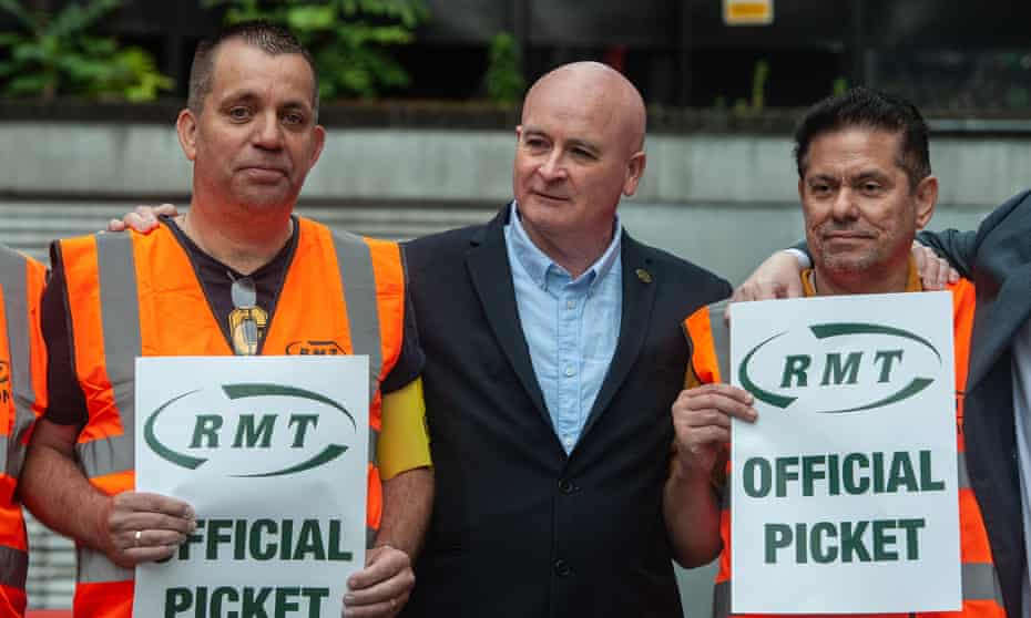 Mick Lynch, centre, visits the picket line at Euston station in London.
