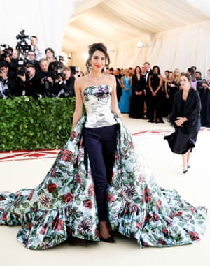 Is there anything human rights lawyer Amal Clooney doesn't ace? The event's other co-chair had her own take on Met Gala style, wearing Richard Quinn's majestic creation of silver foil bustier with dramatic train over navy cigarette pants.