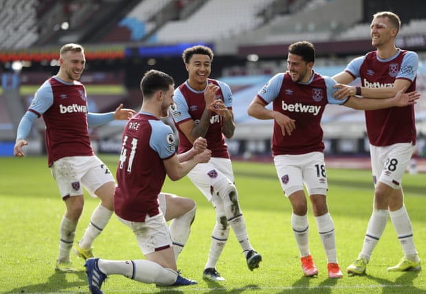 West Ham United’s Jesse Lingard (centre) celebrates with a mock band after scoring against Tottenham.