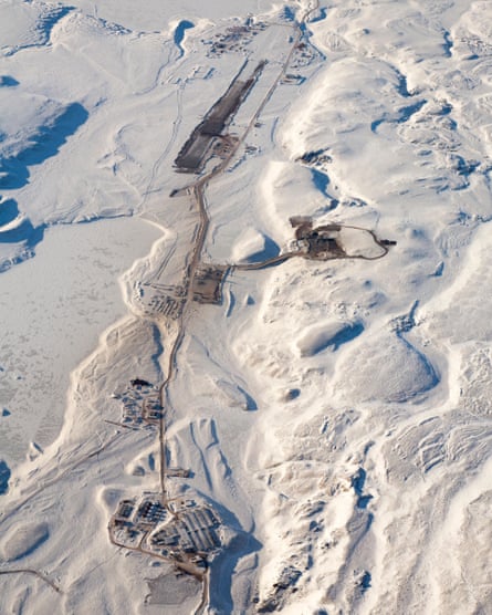 Aerial view of a mine in a snowy Arctic landscape
