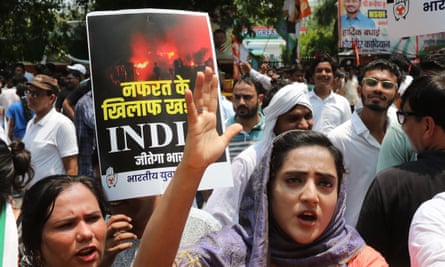 Women protest in the street with signs