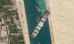 The cargo ship MV Ever Given sits stuck in the Suez Canal. (Photograph: Planet Labs Inc. via AP)