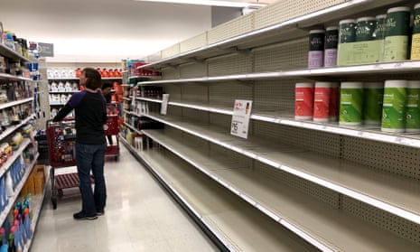 Shelves where disinfectant wipes are usually stocked are nearly empty at a Target store on 2 March 2020 in Novato, California. 