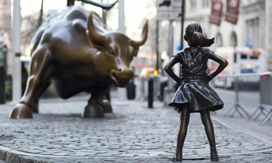 The ‘Charging Bull’ and ‘Fearless Girl’ statues on Lower Broadway in New York. 