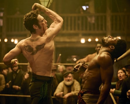 James Nelson-Joyce as Treacle Goodson bare-knuckle boxing, shirtless and delivering a right hook in A Thousand Blows.