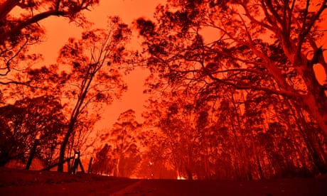 The afternoon sky glows red from bushfires around the Australian town of Nowra on 31 December 2019