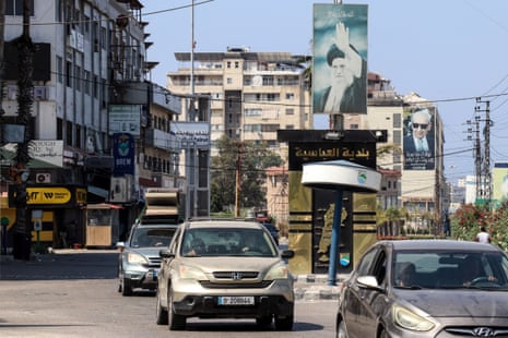 Vehicles exit Tyre in southern Lebanon after the Israeli army warned the entire city to evacuate ahead of strikes.