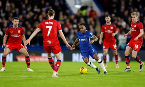 Chelsea's Raheem Sterling surges forward against Preston.