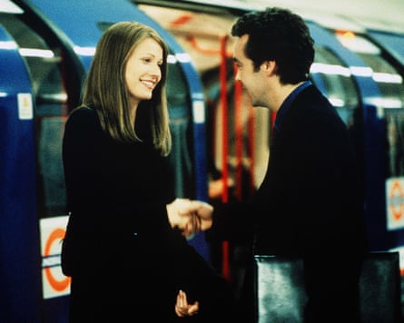 The shake hands next to a tube train
