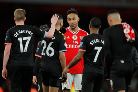 Pierre-Emerick Aubameyang shakes hands with the City players at the final whistle.