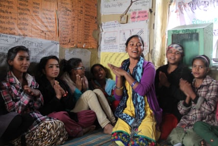 Rachana Sunar discussing child marriage with girls in her village