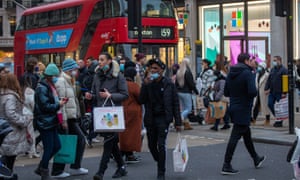 Christmas shoppers swarm London’s West End amid record levels of Covid-19 infections, England, on 18 December.