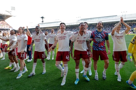 Arsenal’s Declan Rice and Gabriel Magalhaes with teammates celebrate after the match at Crystal Palace.