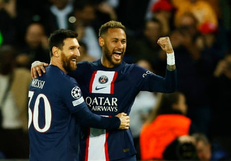 Paris St Germain's Neymar celebrates scoring their third goal with Lionel Messi.