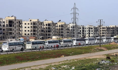 Buses carrying Syrian citizens arrive in Aleppo on Friday after evacuations from the pro-government villages of Foua and Kfarya.