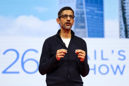 Google’s chief executive, Sundar Pichai, speaks during a keynote session wearing a black quarter-zip cardigan