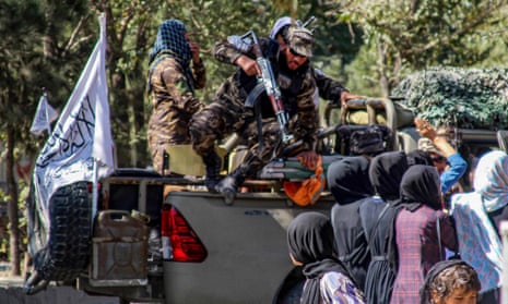 Taliban forces disperse women who were protesting over a suicide bomb attack