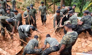 Sri Lankan military rescuers following a landslide in Bulathkohupitiya.