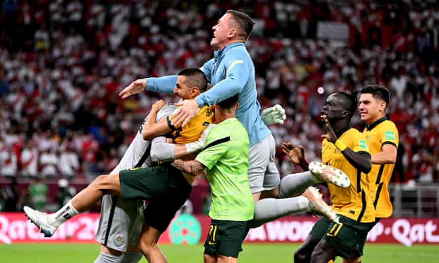 Australia celebrates victory over Peru in the 2022 World Cup play-off match in Doha.