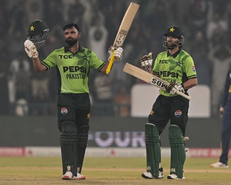 Fakhar Zaman (left) salutes the crowd after sealing his century