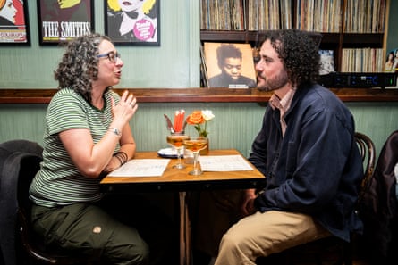 BJ and Toby chatting across a restaurant table