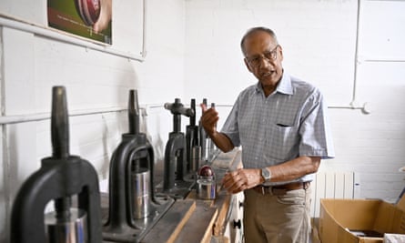 Dilip Jajodia explains how the ball is shaped by hand at the Dukes Cricket ball factory in Walthamstow