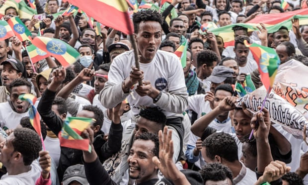 New military recruits in Addis Ababa wave the Ethiopian flag.
